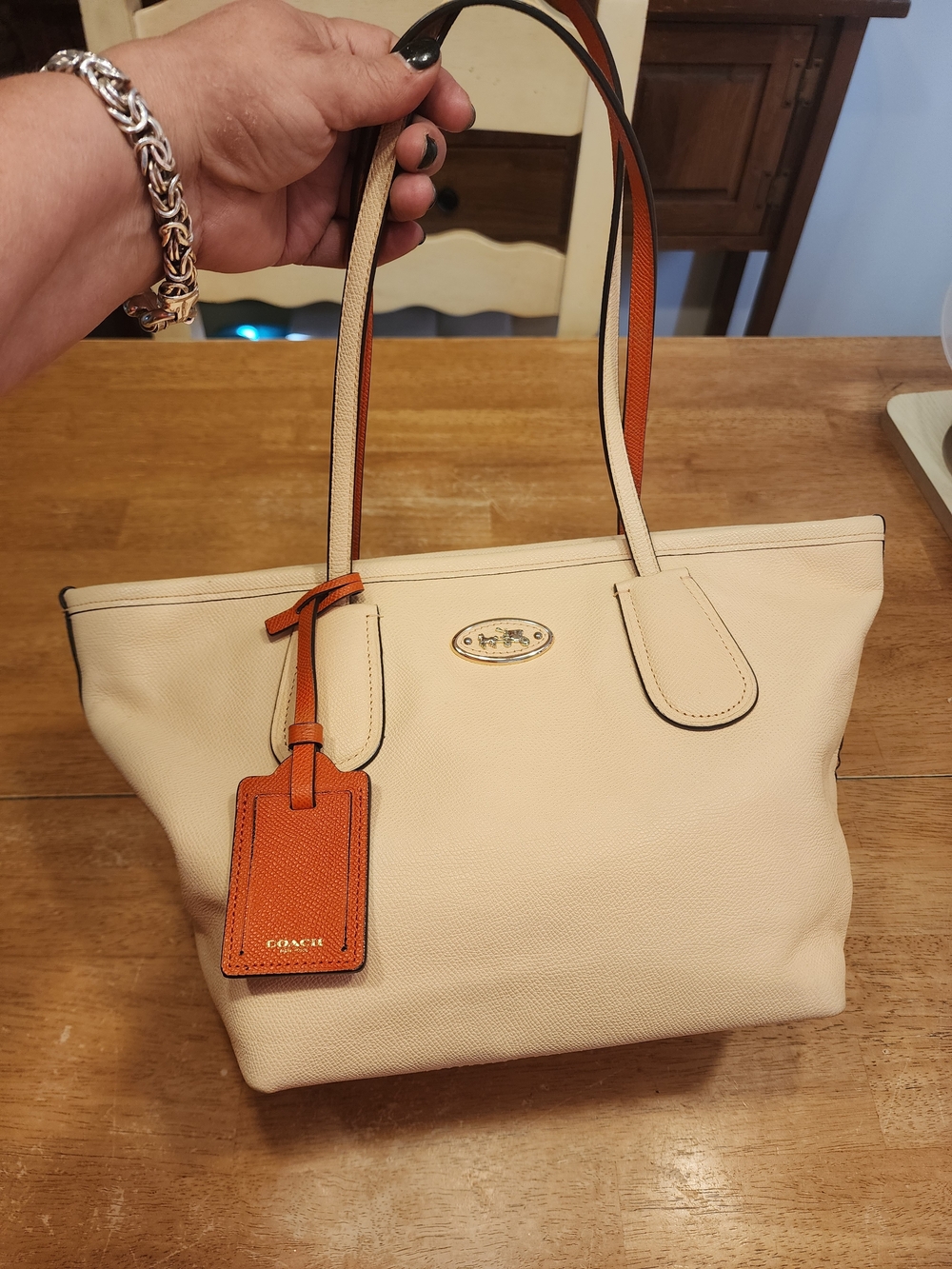 Coach Colorblock Leather Taxi Zip Tote in the Apricot & Coral colorway